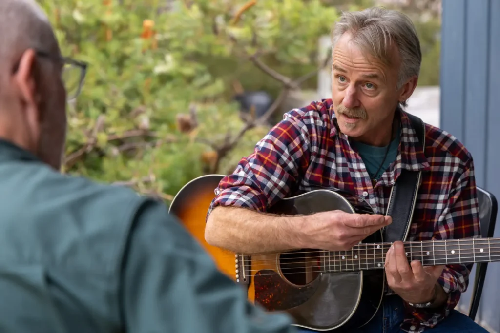 Geoff Achison working with participants during the Acoustic Guitar Weekend