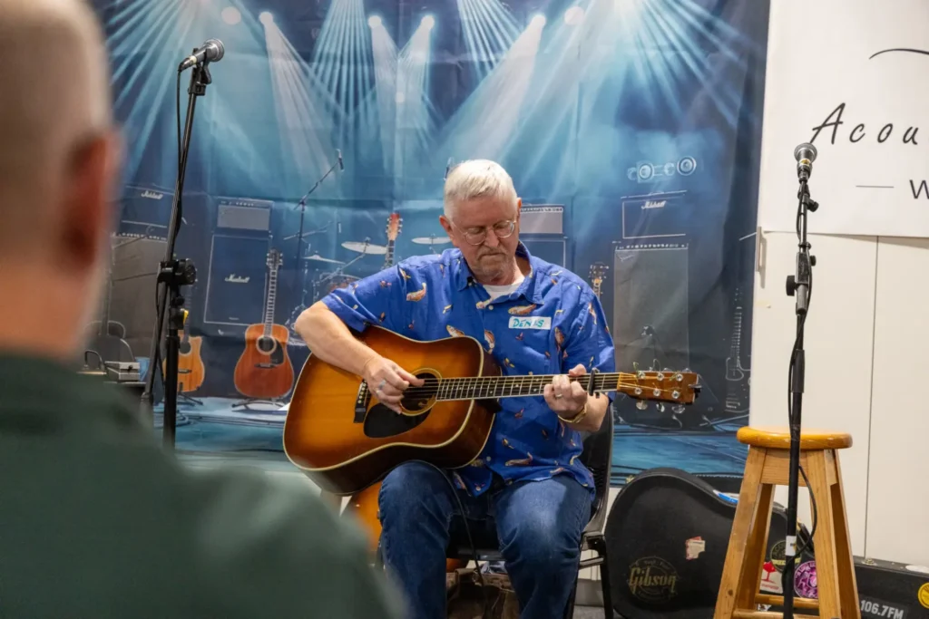 Participant performing during the Saturday night open mic session