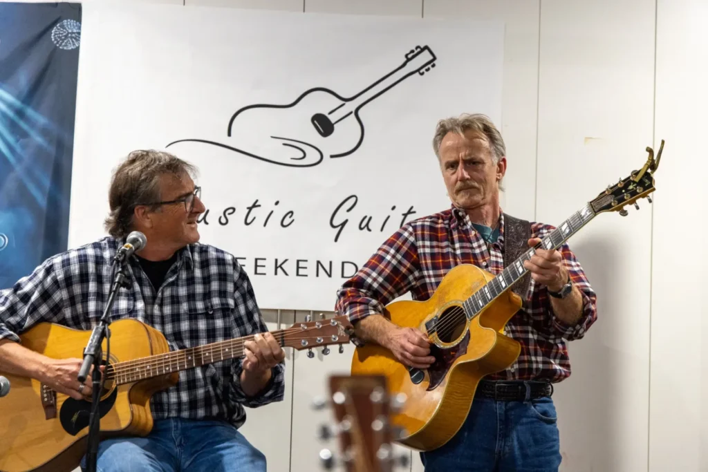 Participant performing with Geoff Achison during the Saturday night open mic session