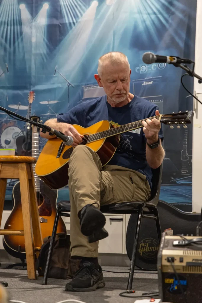 Participant performing during the Saturday night open mic session